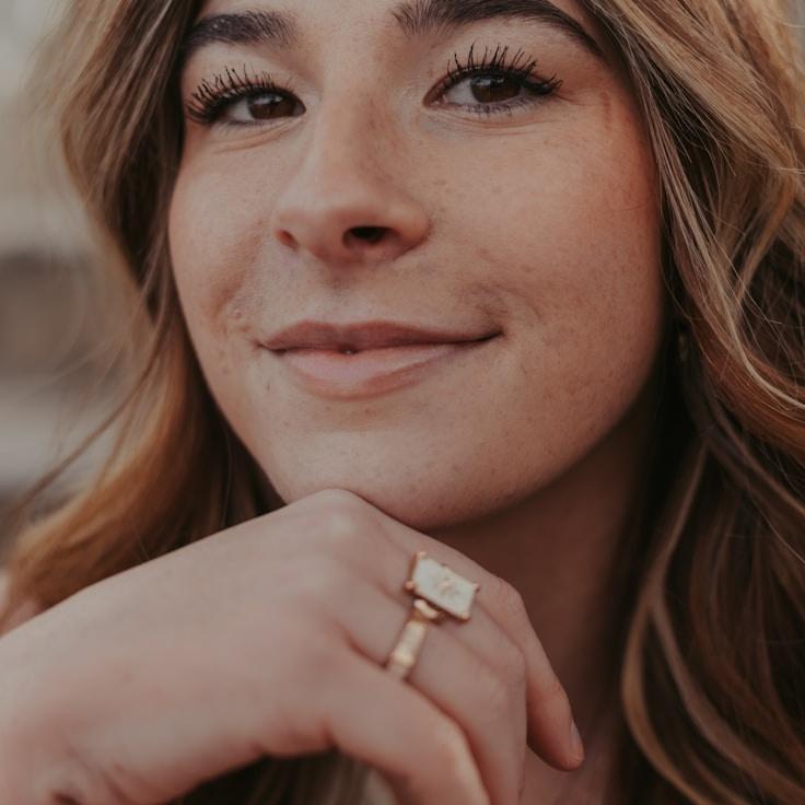 Kaveri Mehta, Lead Design Curator at Spark Path Studio, reviewing corporate floral arrangements